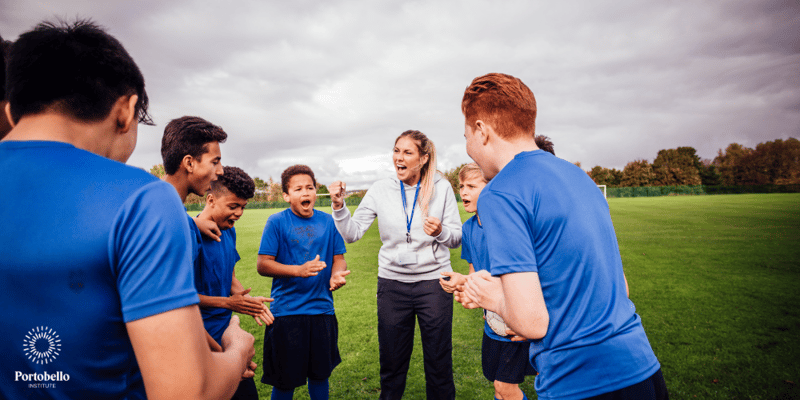 A sports coach encouraging a young team