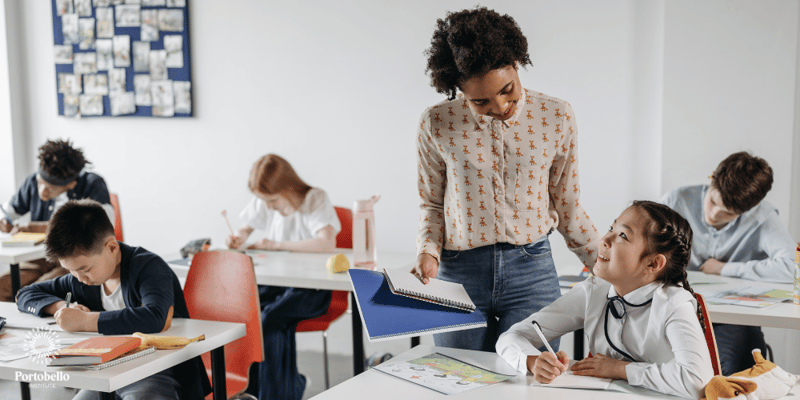 Teacher helping a student in a classroom