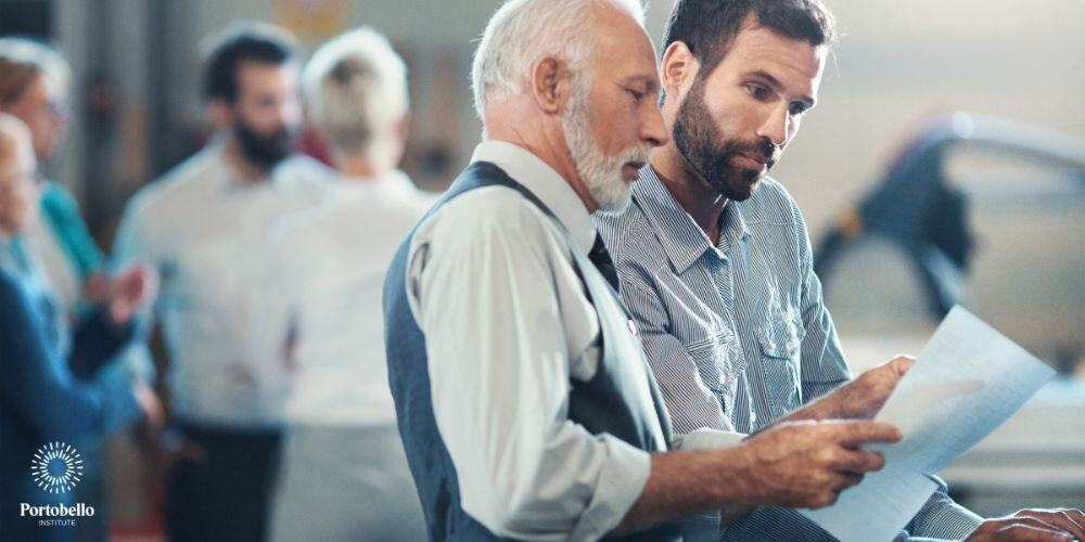 facilities managers working, looking at a sheet of paper in a work environment