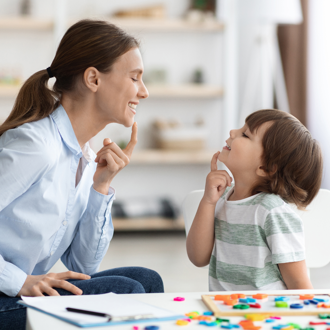 Speech and language therapist working with a young child