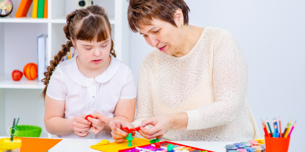sen teacher helping a young student with her class work