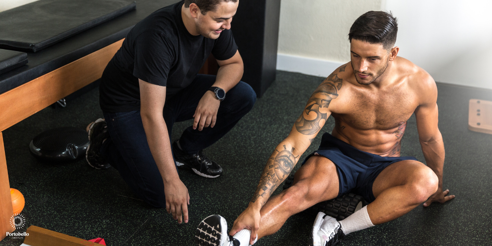 sports therapist working with an elite athlete