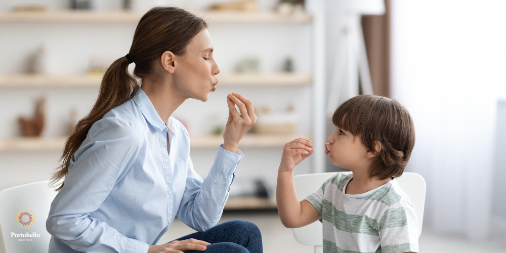 a speech and language therapist working with a young child