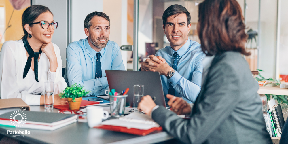 People talking at a desk