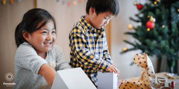 Children opening Christmas presents