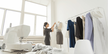 a fashion buyer working with clothes on a mannequin