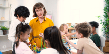 a teacher with children in a classroom