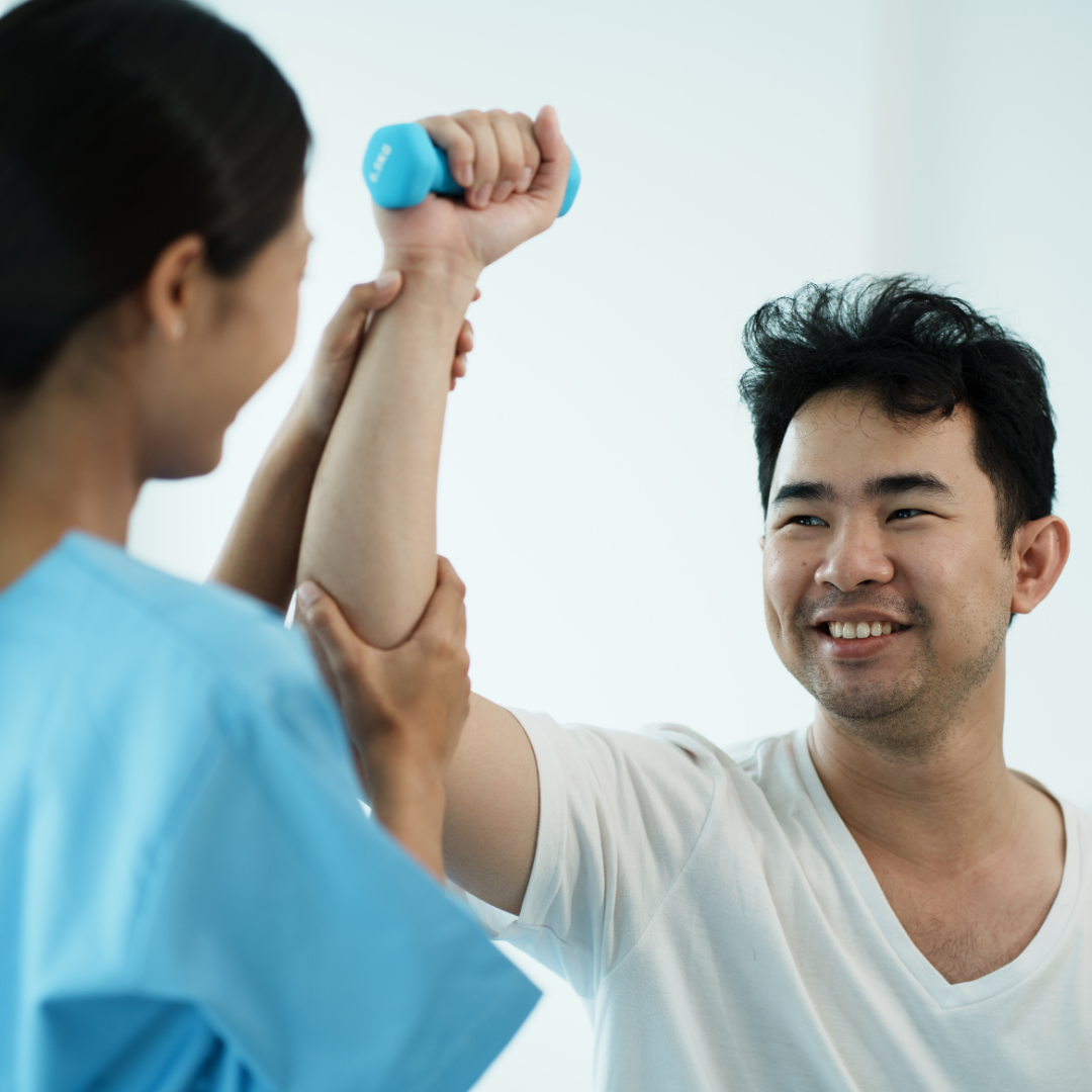 Healthcare professional helping a man lift a light weight by supporting his arm