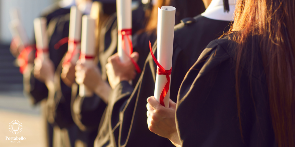 graduates holding scrolls