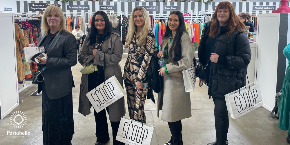five women holding shopping bags at Scoop London fashion buying event
